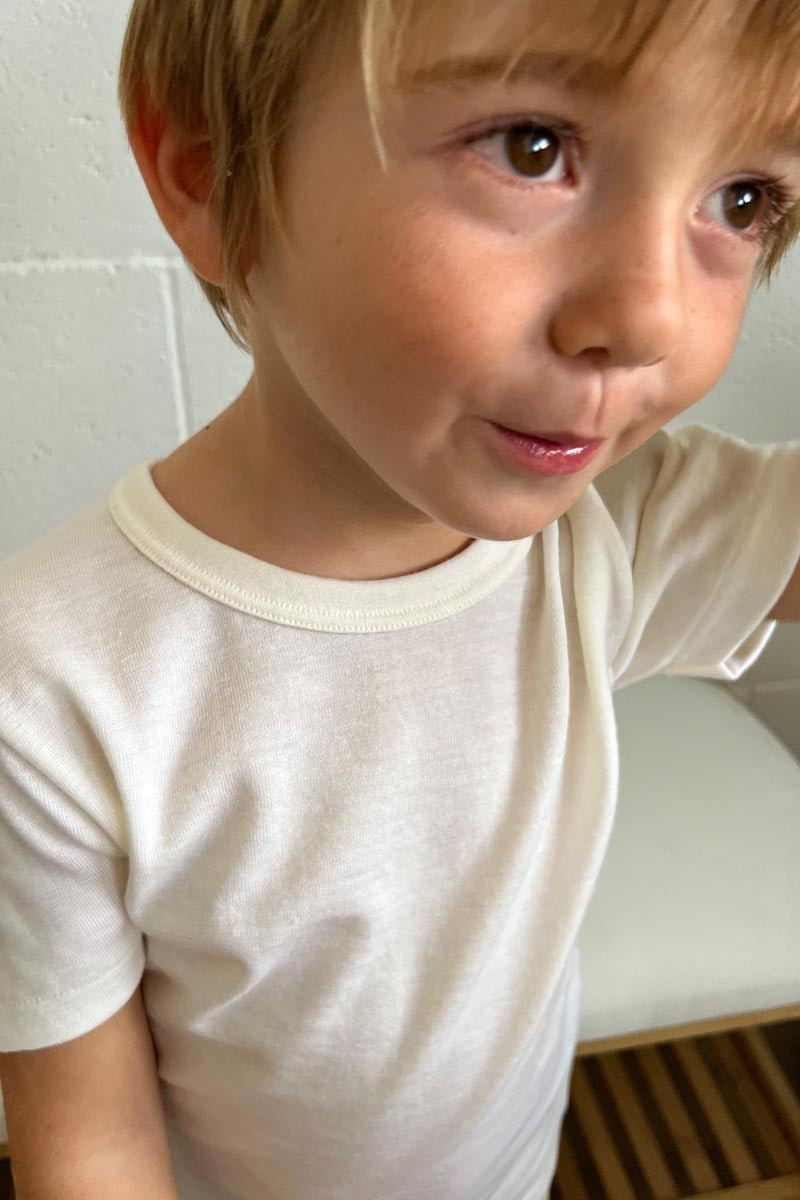 Maglietta intima bambino Trottola in lana e seta - Delicata sulla pelle e mezza manica